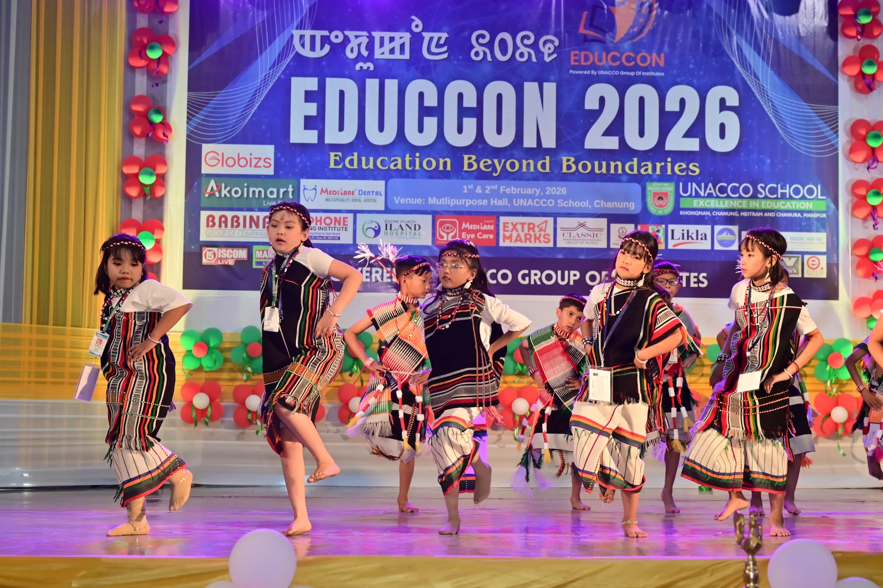Young performers move together in a celebration of identity.
