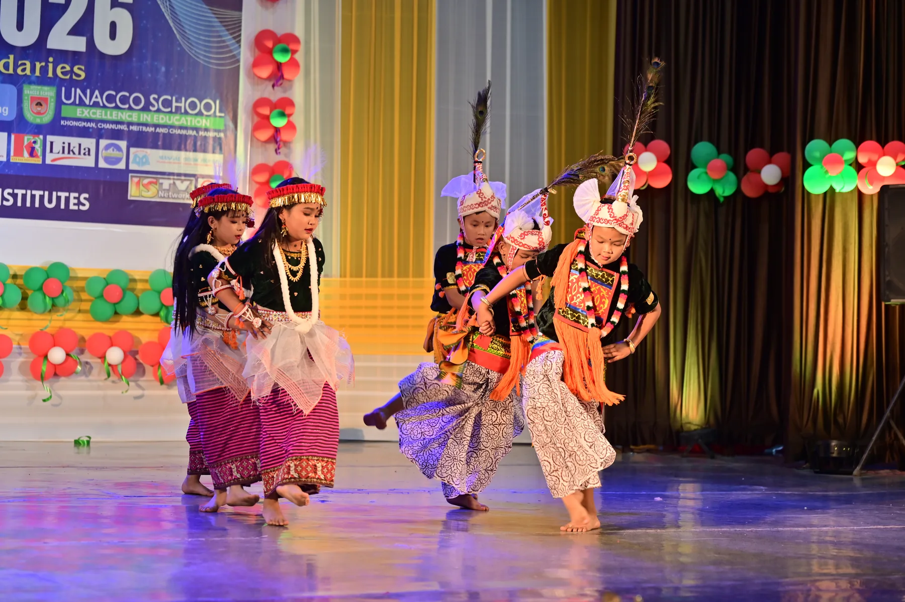 Rhythmic storytellers fill the arena with rhythm, colour and joy.