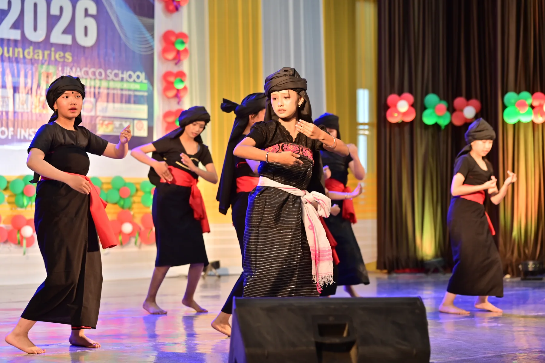 Festival performers fill the arena with rhythm, colour and joy.